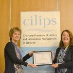 Jenny Des Fountain receiving honorary membership from CILIPS President Theresa Breslin