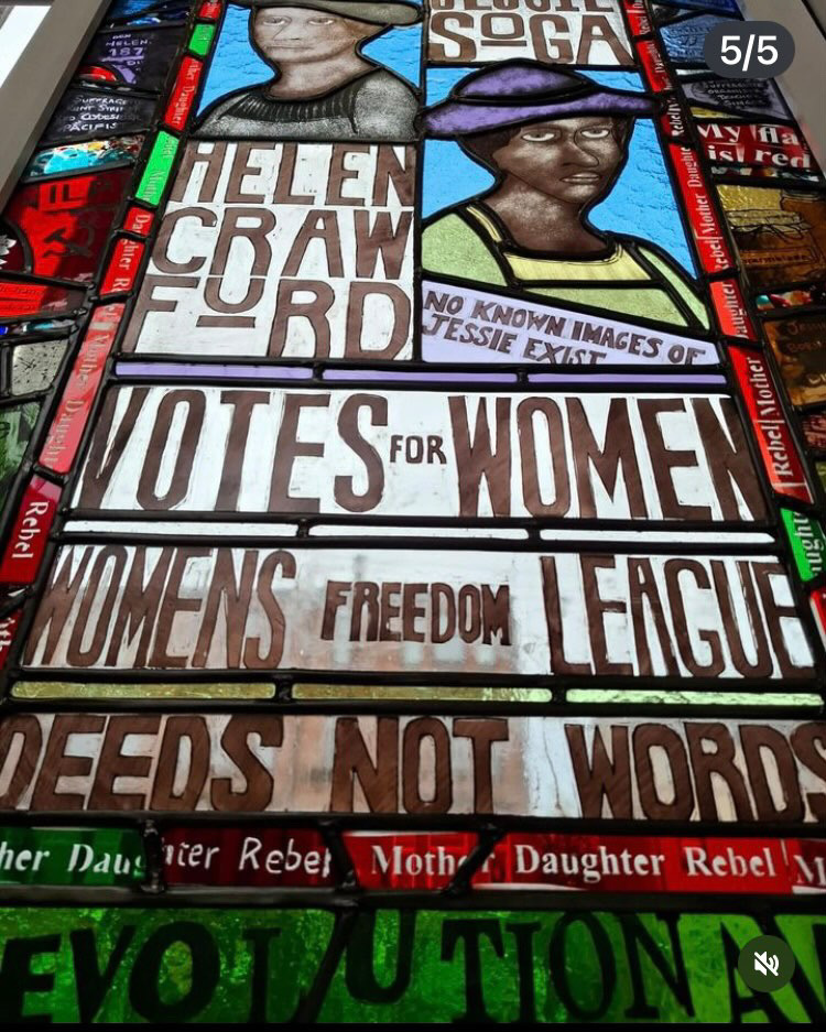 Suffragette Window showing Helen Crawford and Jessie Soga with text including 'votes for women, womens freedom league and deeds not words.'