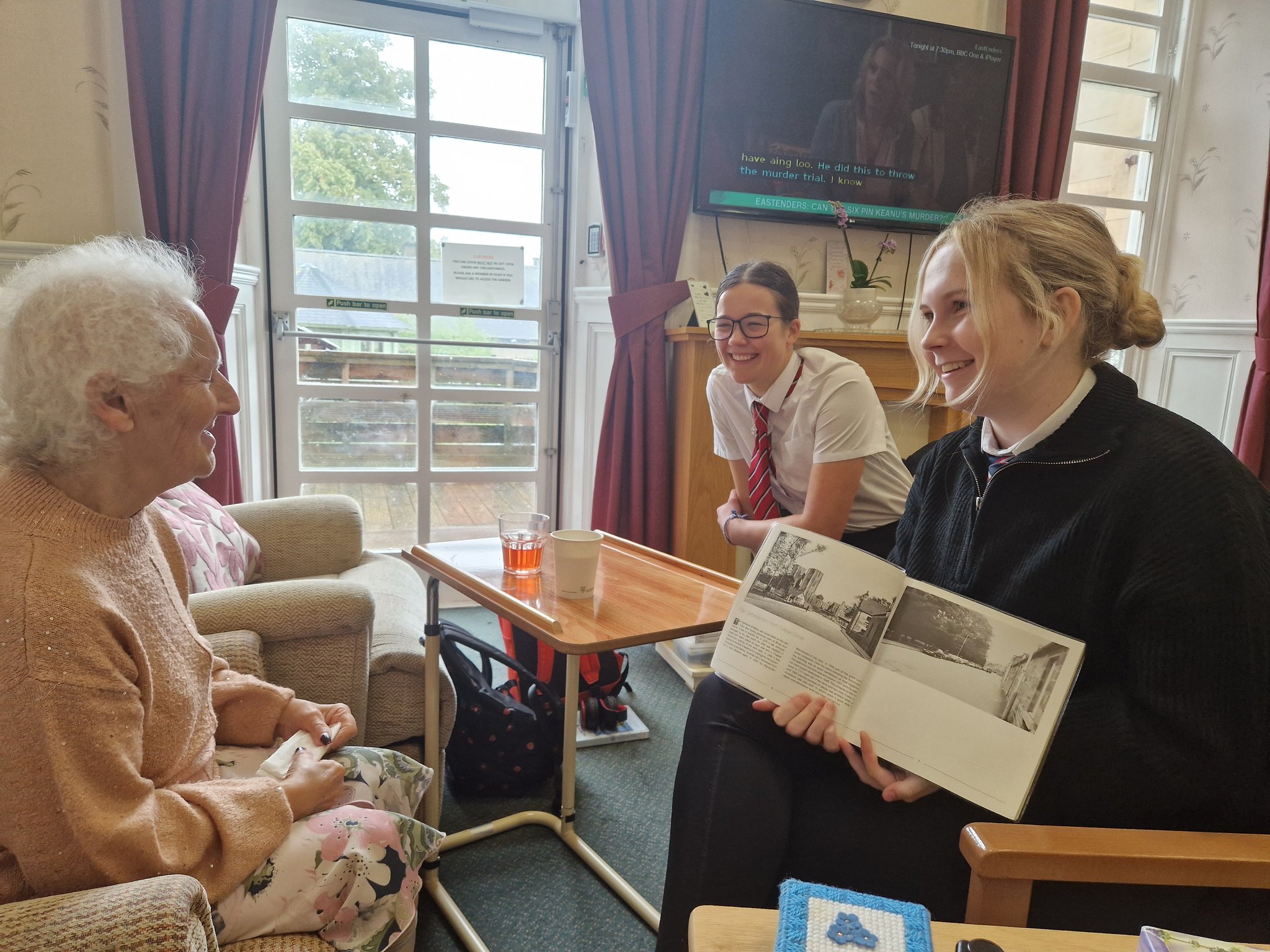 Pupils from Elgin Academy intergenerational reading with Anderson’s Care Home residents.